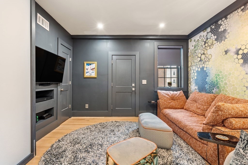 135 Beaconsfield Road, Unit 2 Brookline, MA 02445 - Photo 21 of 33 a living room with furniture and a flat screen tv