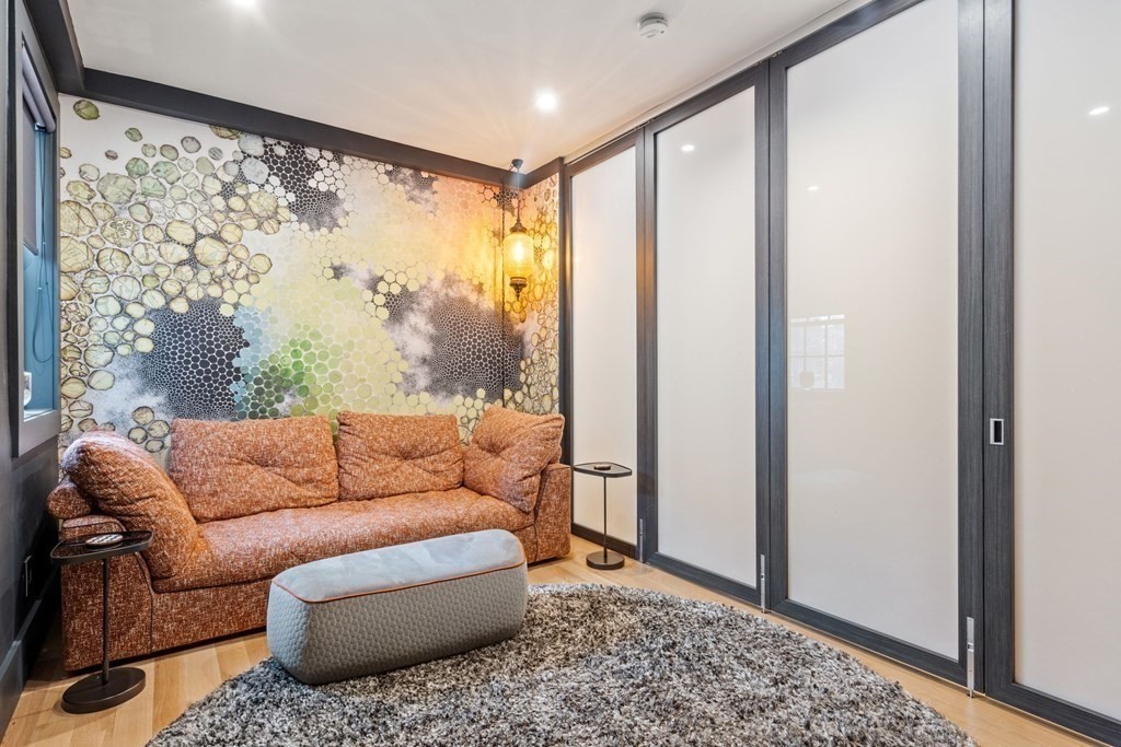 135 Beaconsfield Road, Unit 2 Brookline, MA 02445 - Photo 23 of 33 a living room with furniture and a large window