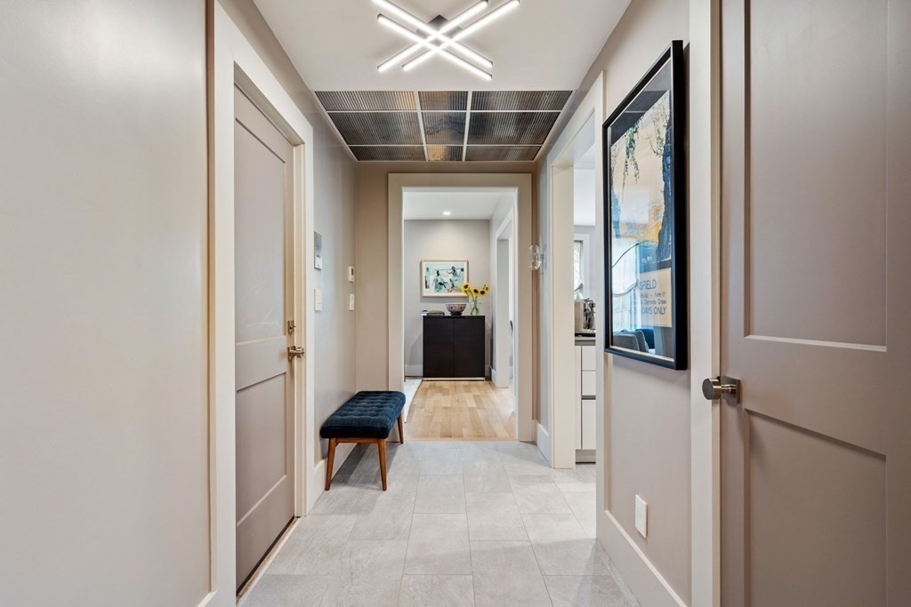 135 Beaconsfield Road, Unit 2 Brookline, MA 02445 - Photo 25 of 33 a view of a hallway with furniture and front door