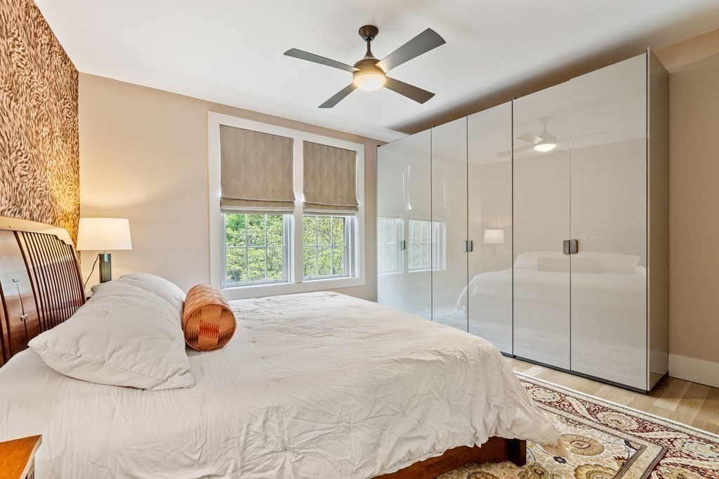 135 Beaconsfield Road, Unit 2 Brookline, MA 02445 - Photo 27 of 33 a bedroom with a bed and a large window