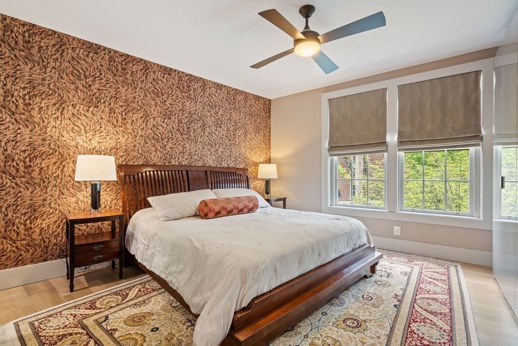 135 Beaconsfield Road, Unit 2 Brookline, MA 02445 - Photo 7 of 33 a bedroom with a bed and a lamp