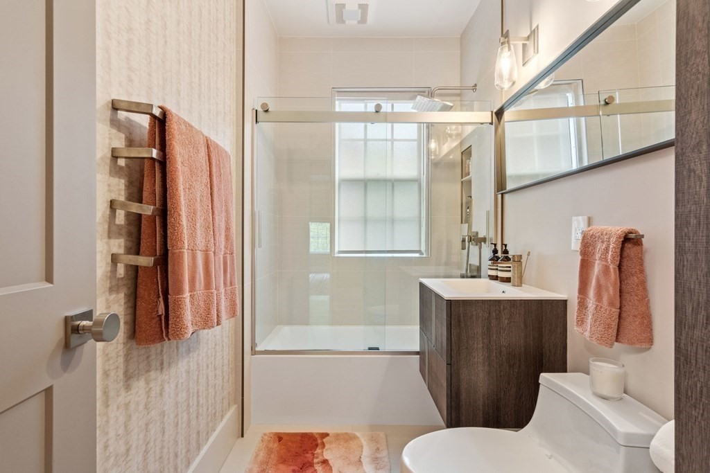 135 Beaconsfield Road, Unit 2 Brookline, MA 02445 - Photo 9 of 33 a bathroom with a granite countertop sink toilet and shower
