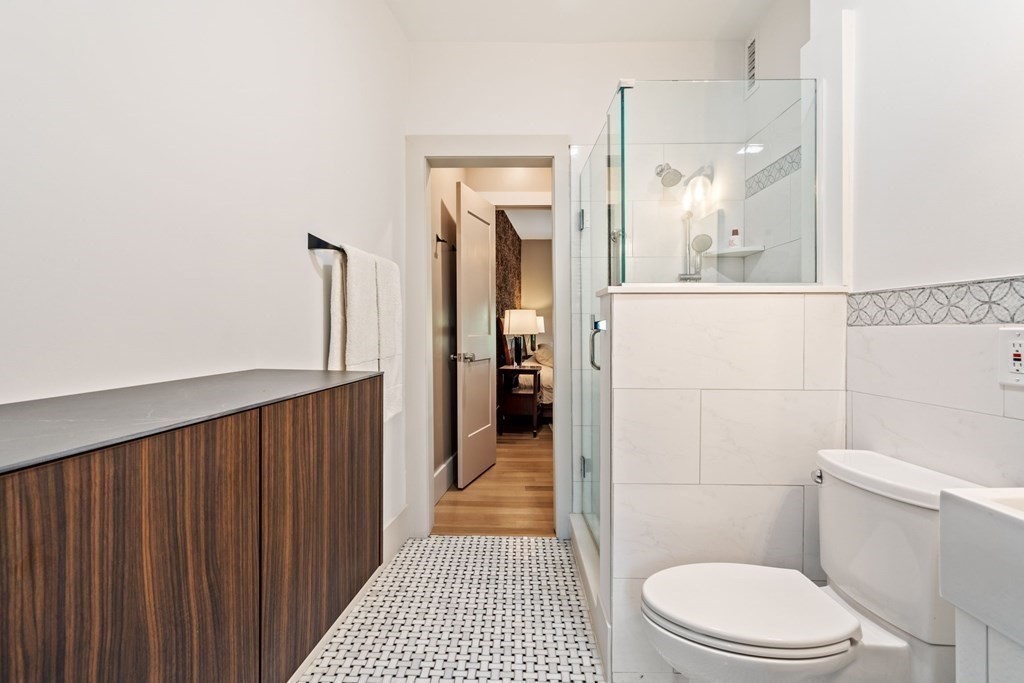 135 Beaconsfield Road, Unit 2 Brookline, MA 02445 - Photo 10 of 33 a bathroom with a toilet and a shower