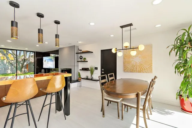 a bathroom with a sink a bathtub and a mirror