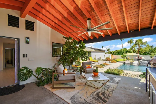 aerial view of a house with a yard and potted plants