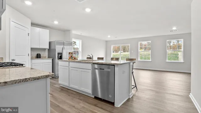 a kitchen with counter top space cabinets and stainless steel appliances