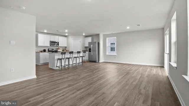 a kitchen with a table and chairs in it
