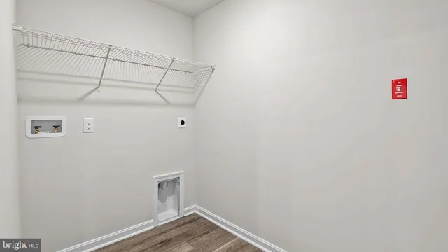 a view of storage and utility room with empty racks