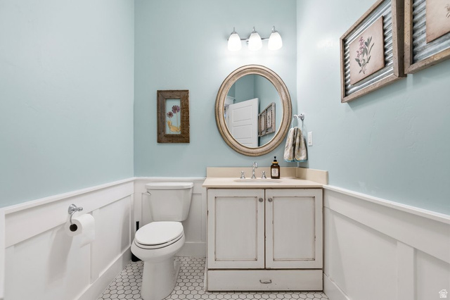 672 Perry Hollow Drive Mapleton, UT 84664 - Photo 64 of 106 1/2 bth, White hexagonal tile flooring complements the wainscoting and light blue walls