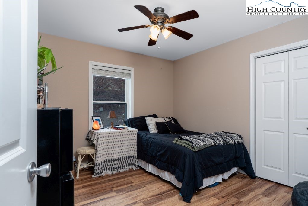 3564 Hickory Nut Gap Road Newland, NC 28657 - Photo 13 of 35 a bedroom with a bed and a window