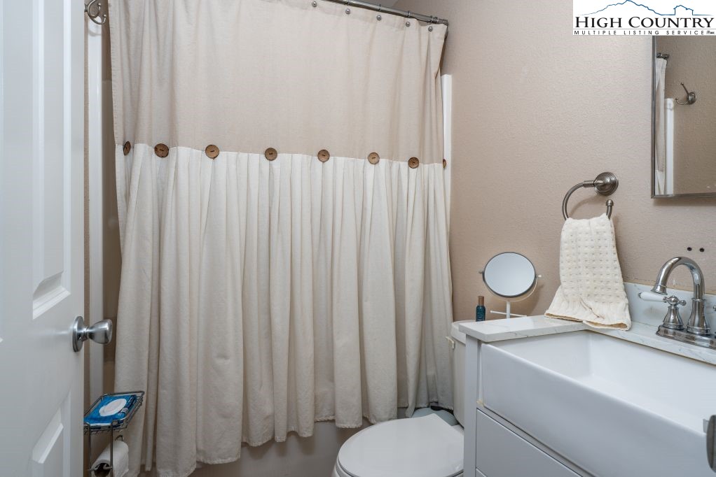 3564 Hickory Nut Gap Road Newland, NC 28657 - Photo 14 of 35 a bathroom with a toilet and a sink