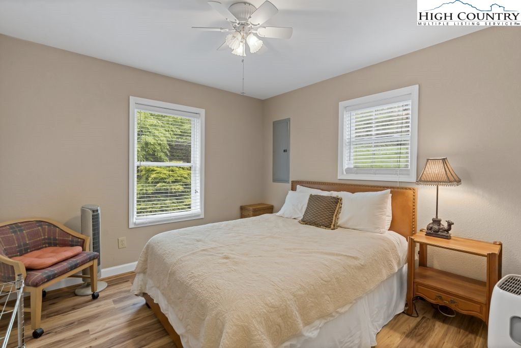 3564 Hickory Nut Gap Road Newland, NC 28657 - Photo 14 of 30 a bedroom with a bed and a window