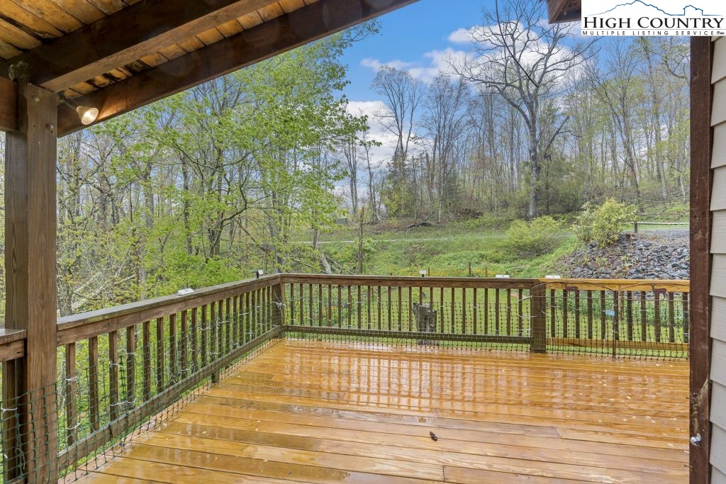 3564 Hickory Nut Gap Road Newland, NC 28657 - Photo 15 of 30 a view of a balcony with wooden floor