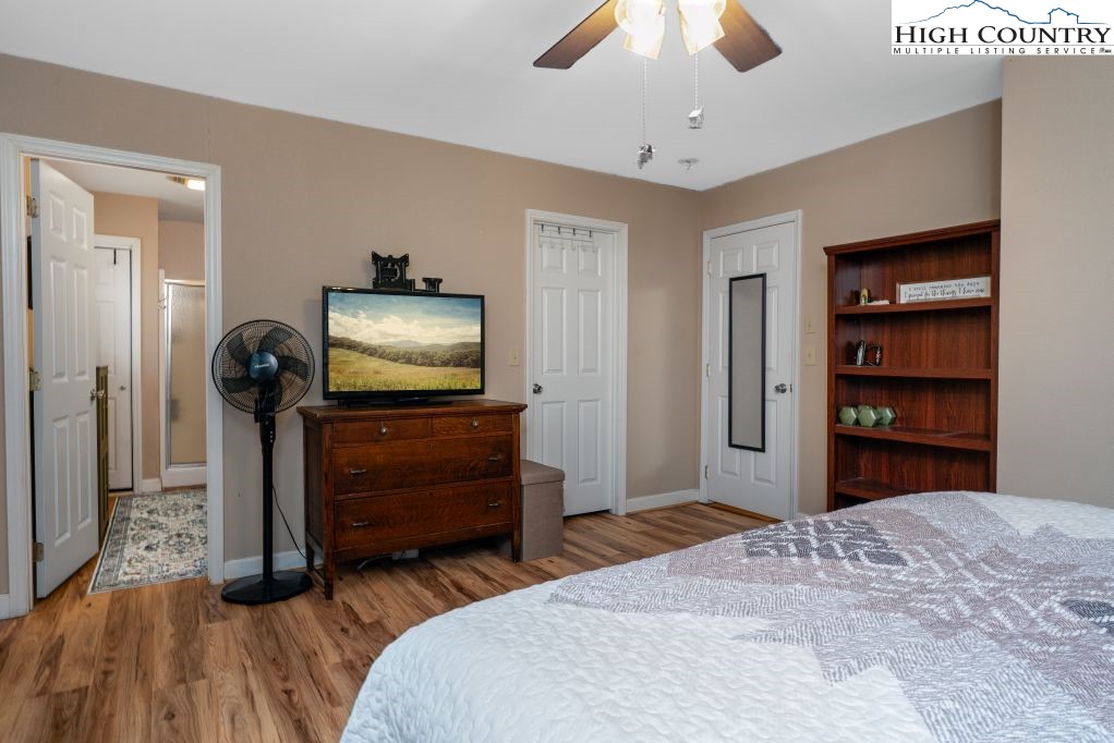 3564 Hickory Nut Gap Road Newland, NC 28657 - Photo 16 of 35 a bedroom with furniture and a flat screen tv