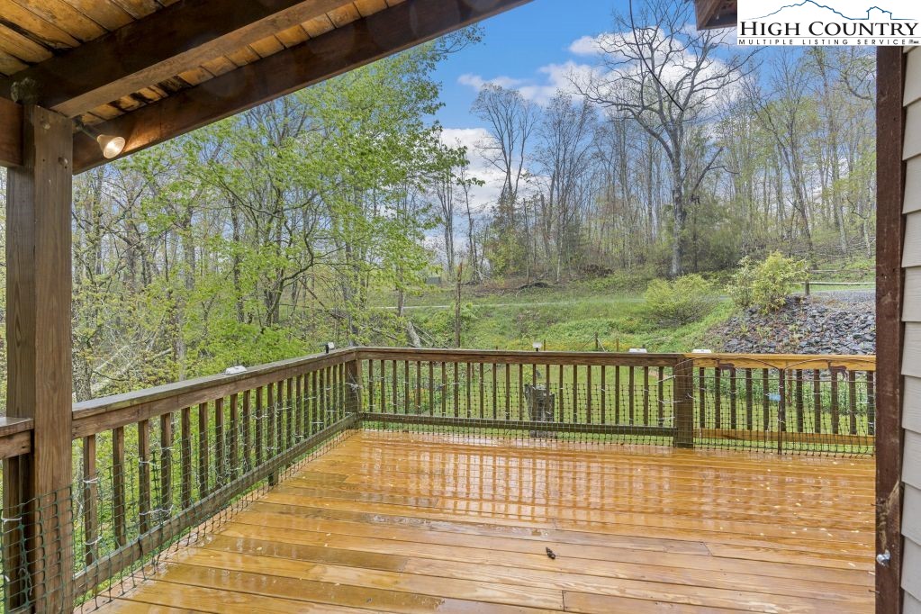 3564 Hickory Nut Gap Road Newland, NC 28657 - Photo 20 of 35 a view of a balcony with wooden floor