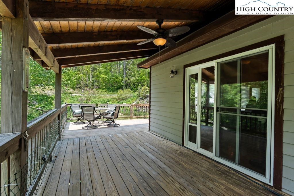 3564 Hickory Nut Gap Road Newland, NC 28657 - Photo 22 of 35 a view of deck with wooden floor and outdoor seating