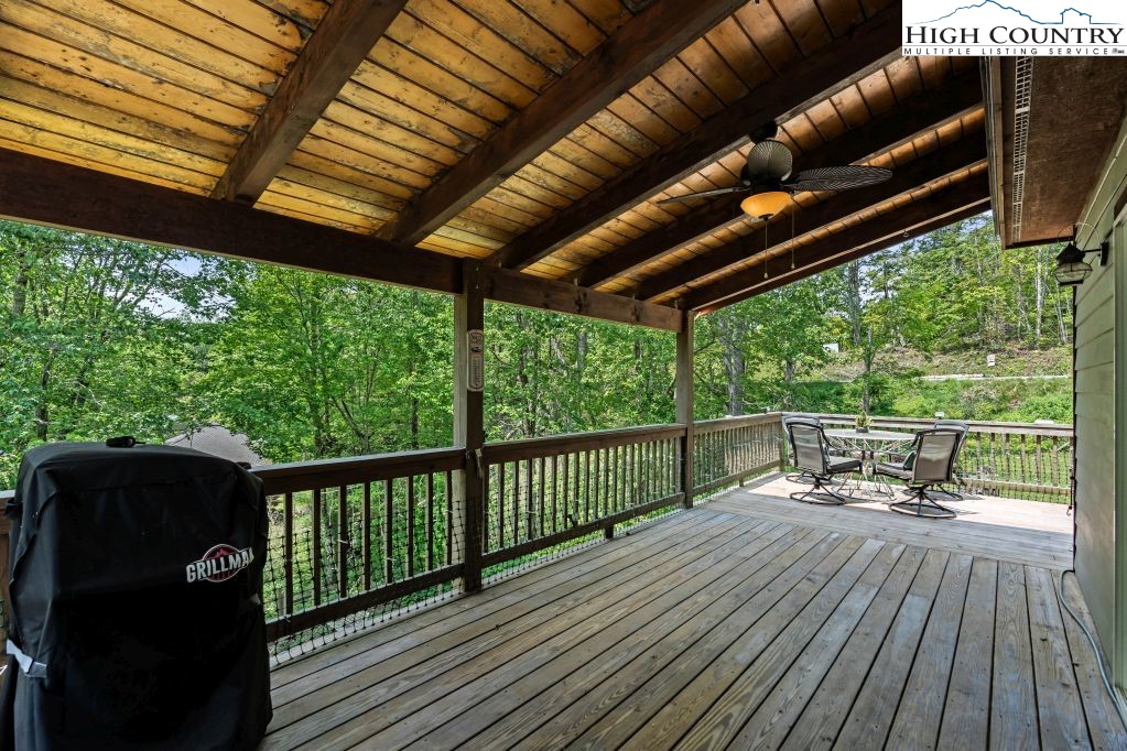 3564 Hickory Nut Gap Road Newland, NC 28657 - Photo 23 of 35 a view of balcony with wooden floor and outdoor seating