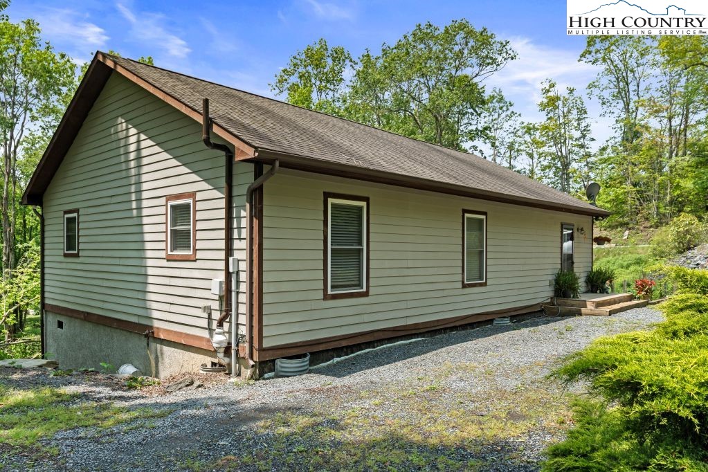 3564 Hickory Nut Gap Road Newland, NC 28657 - Photo 27 of 35 a view of a house with a yard