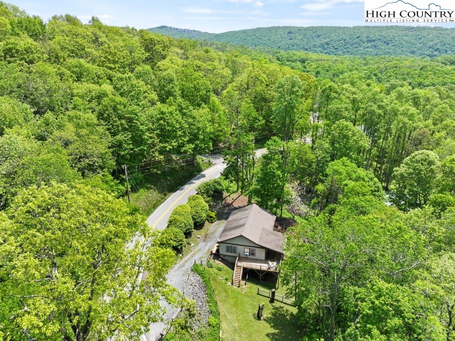 3564 Hickory Nut Gap Road Newland, NC 28657 - Photo 32 of 35 a view of a house with a yard