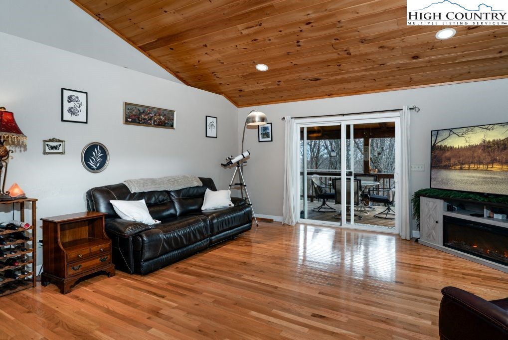 3564 Hickory Nut Gap Road Newland, NC 28657 - Photo 5 of 35 a living room with furniture wooden floor and a flat screen tv