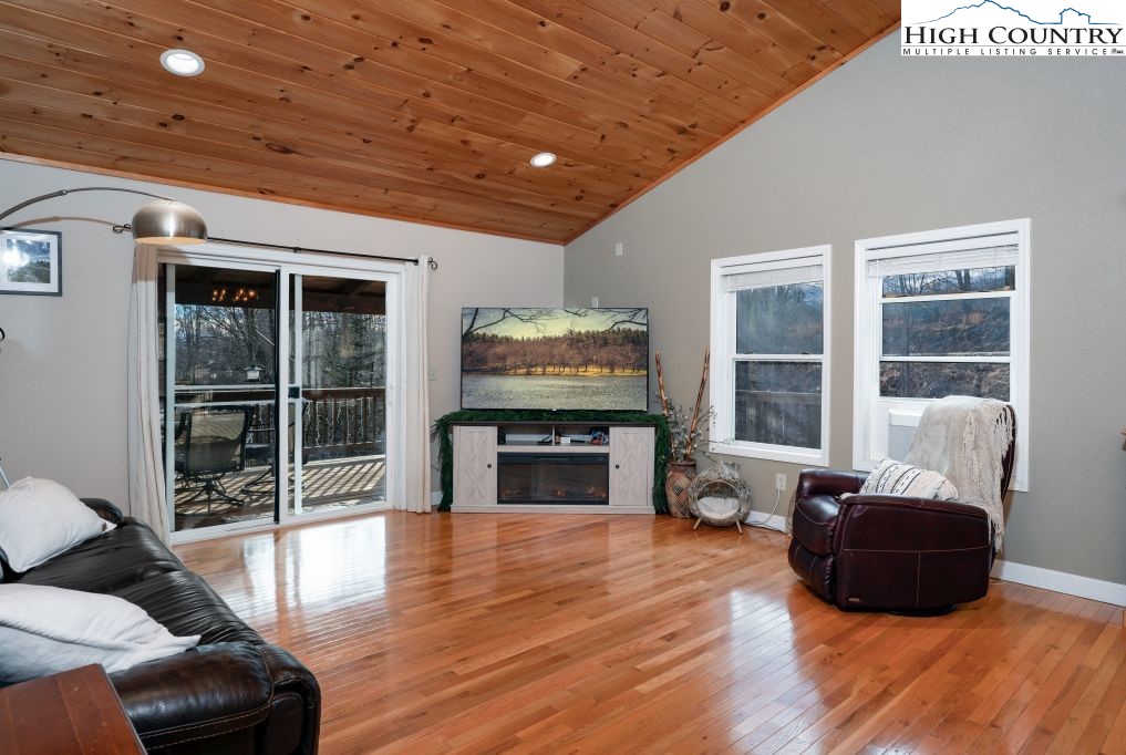 3564 Hickory Nut Gap Road Newland, NC 28657 - Photo 6 of 35 a living room with furniture fireplace and flat screen tv