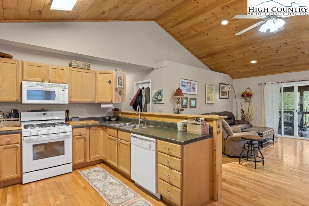 3564 Hickory Nut Gap Road Newland, NC 28657 - Photo 6 of 30 a view of a kitchen with cabinets and wooden floor