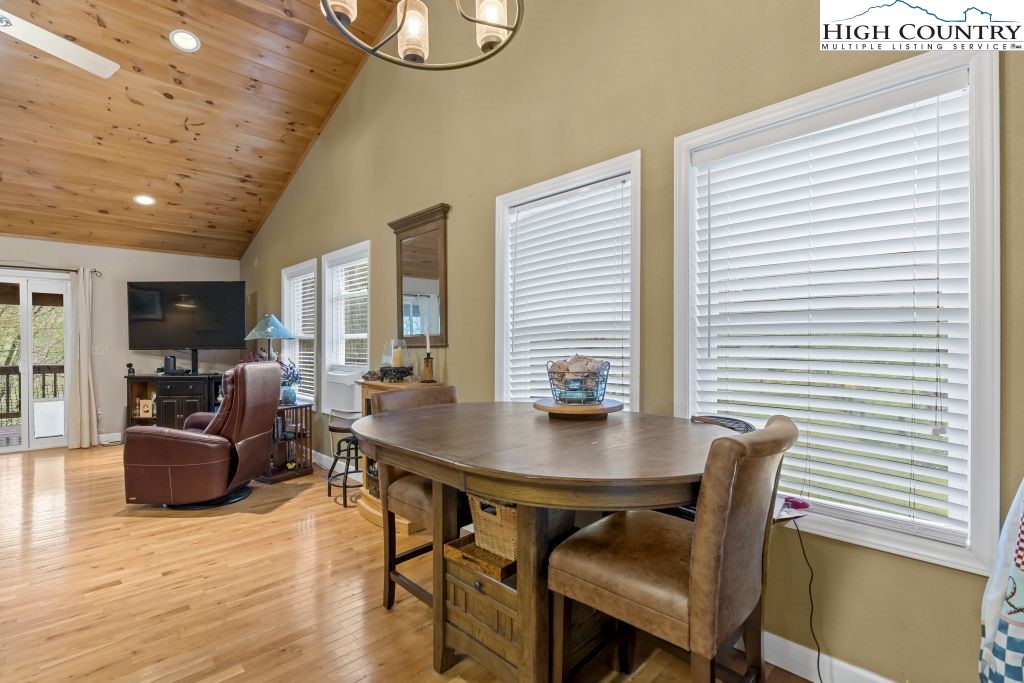 3564 Hickory Nut Gap Road Newland, NC 28657 - Photo 9 of 30 a view of a dining room with furniture and wooden floor