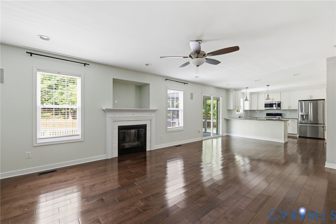 13524 Mountcastle Road Chesterfield, VA 23832 - Photo 10 of 44 Spacious living area featuring rich wood-finish fl