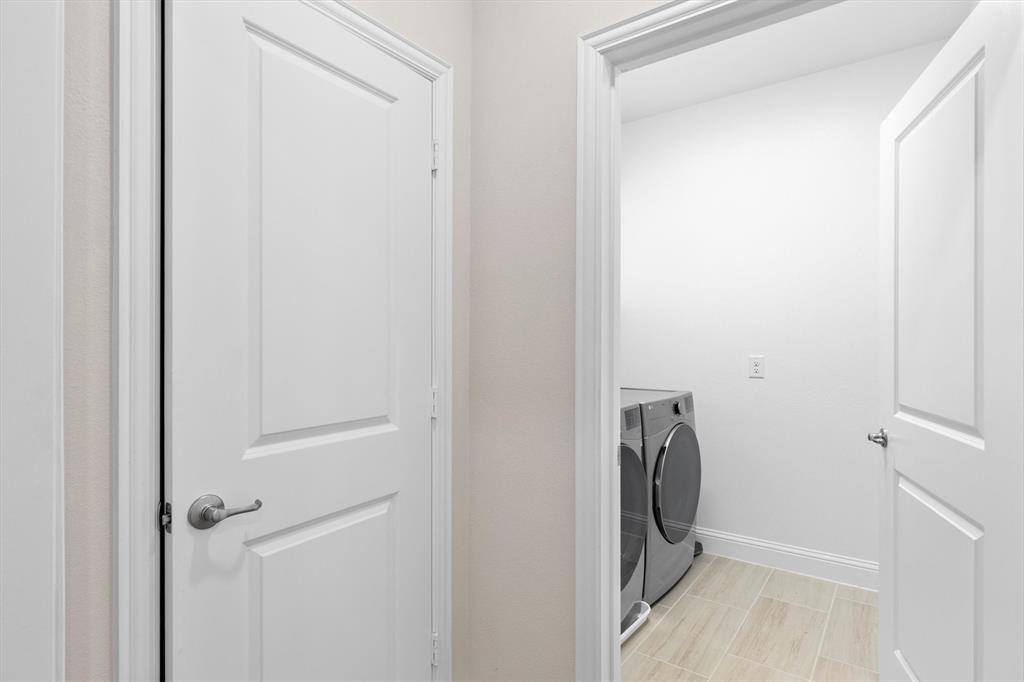 651 Watters Road, Unit 4403 Allen, TX 75013 - Photo 28 of 37 a view of a bathroom with a washer and dryer