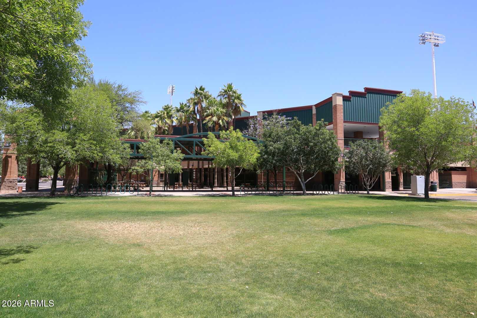 303 North Miller Road, Unit 1007 Scottsdale, AZ 85257 - Photo 39 of 45 a view of a big room with a big yard and large trees