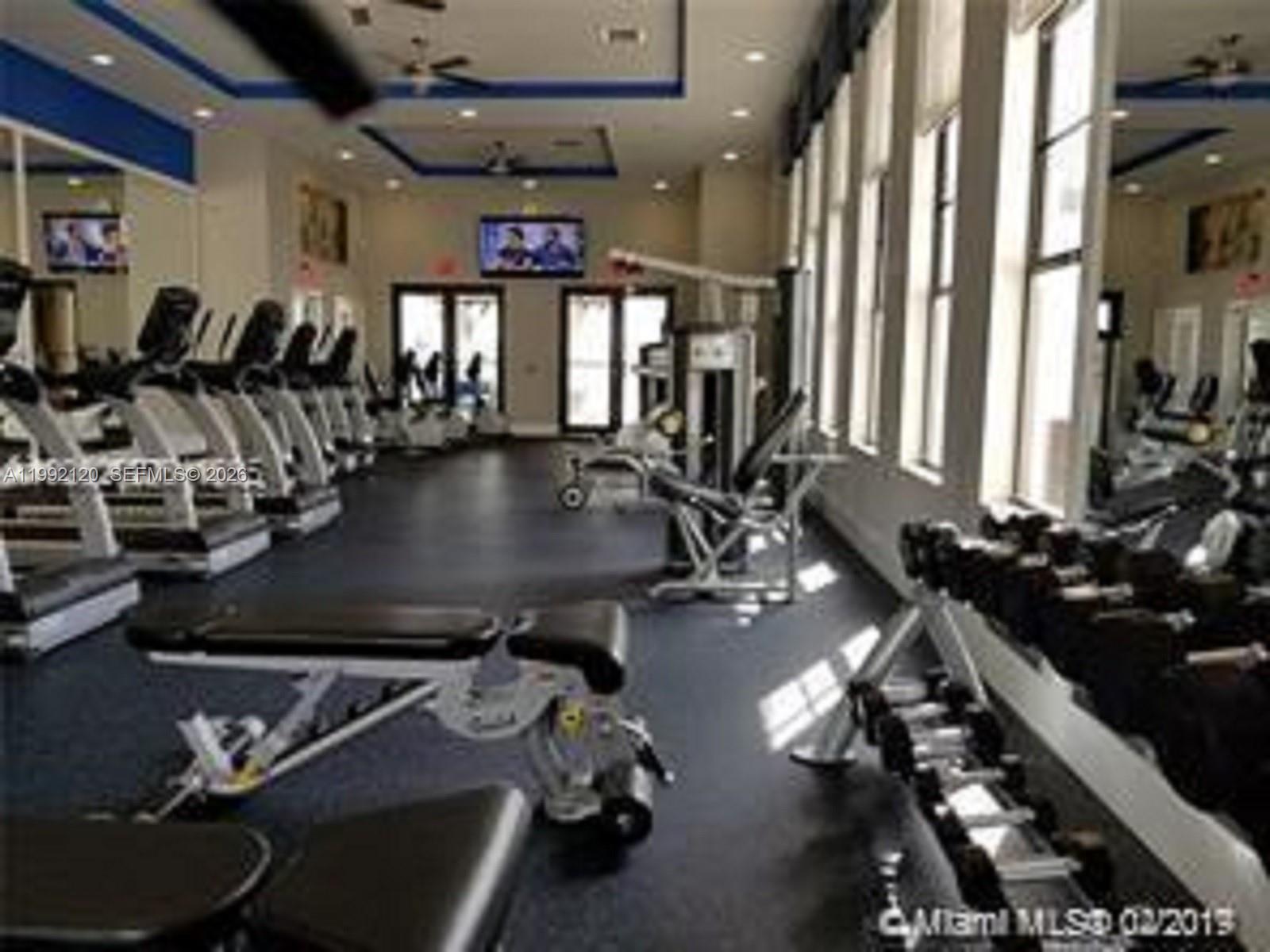 17000 Southwest 90th Terrace Miami, FL 33196 - Photo 43 of 56 a view of a room with gym equipment