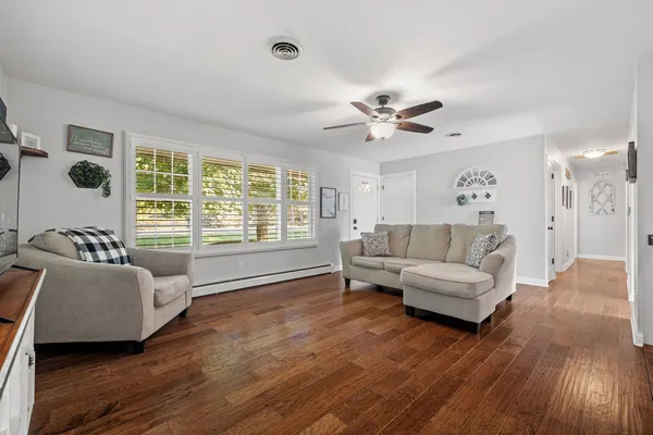 a living room with furniture and a large window