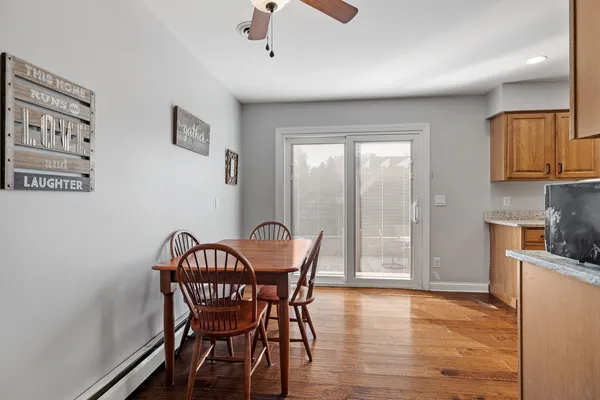 a view of a dining room with furniture window and wooden floor