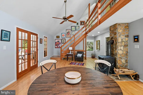 a view of a livingroom with furniture window and wooden floor