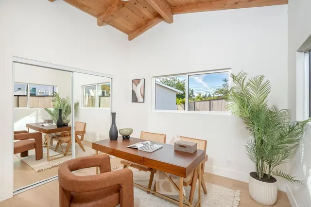a workspace with furniture and a potted plant