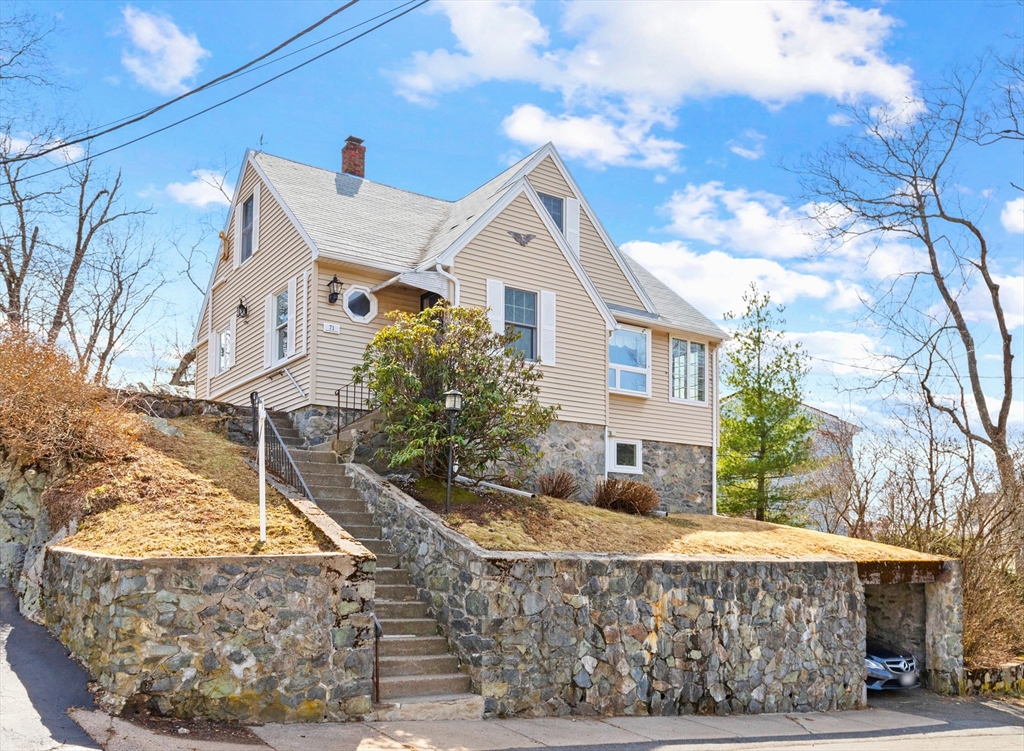 71 Woodland Road Malden, MA 02148 - Photo 1 of 41 a front view of a house with a yard