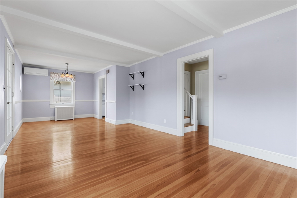 71 Woodland Road Malden, MA 02148 - Photo 13 of 41 a view of empty room with wooden floor