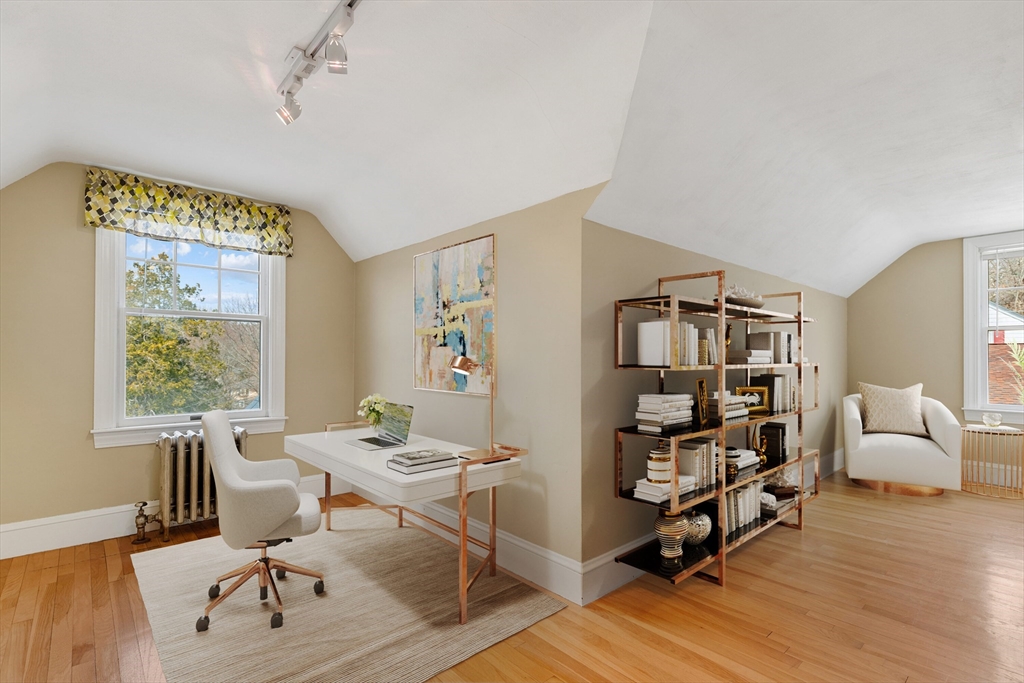 71 Woodland Road Malden, MA 02148 - Photo 24 of 41 a living room with furniture and a wooden floor