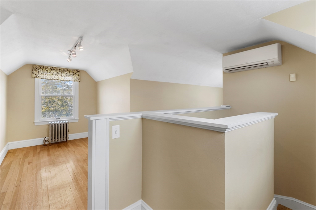 71 Woodland Road Malden, MA 02148 - Photo 26 of 41 a view of an empty room with a window