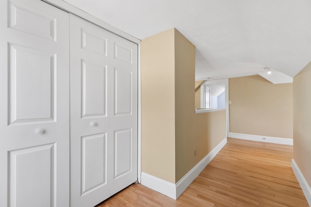 71 Woodland Road Malden, MA 02148 - Photo 28 of 41 a view of a hallway with wooden floor