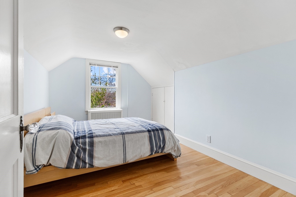 71 Woodland Road Malden, MA 02148 - Photo 29 of 41 a bedroom with a bed and window