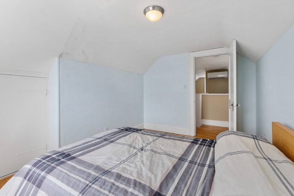 71 Woodland Road Malden, MA 02148 - Photo 30 of 41 a bedroom with a bed and a window