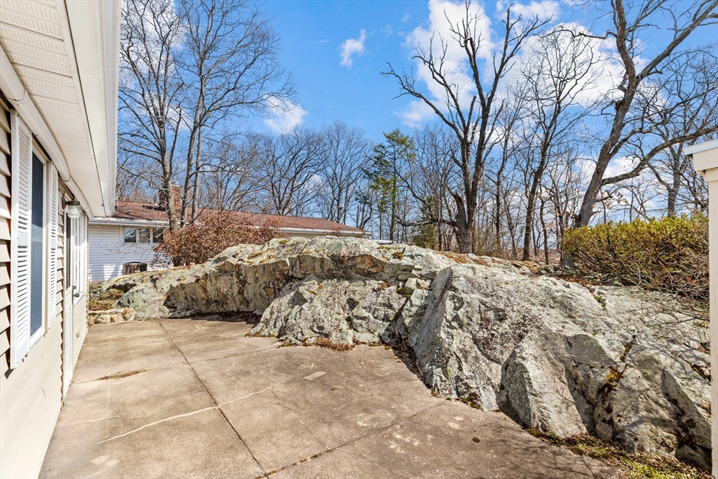 71 Woodland Road Malden, MA 02148 - Photo 34 of 41 a view of a yard covered with snow in front of house