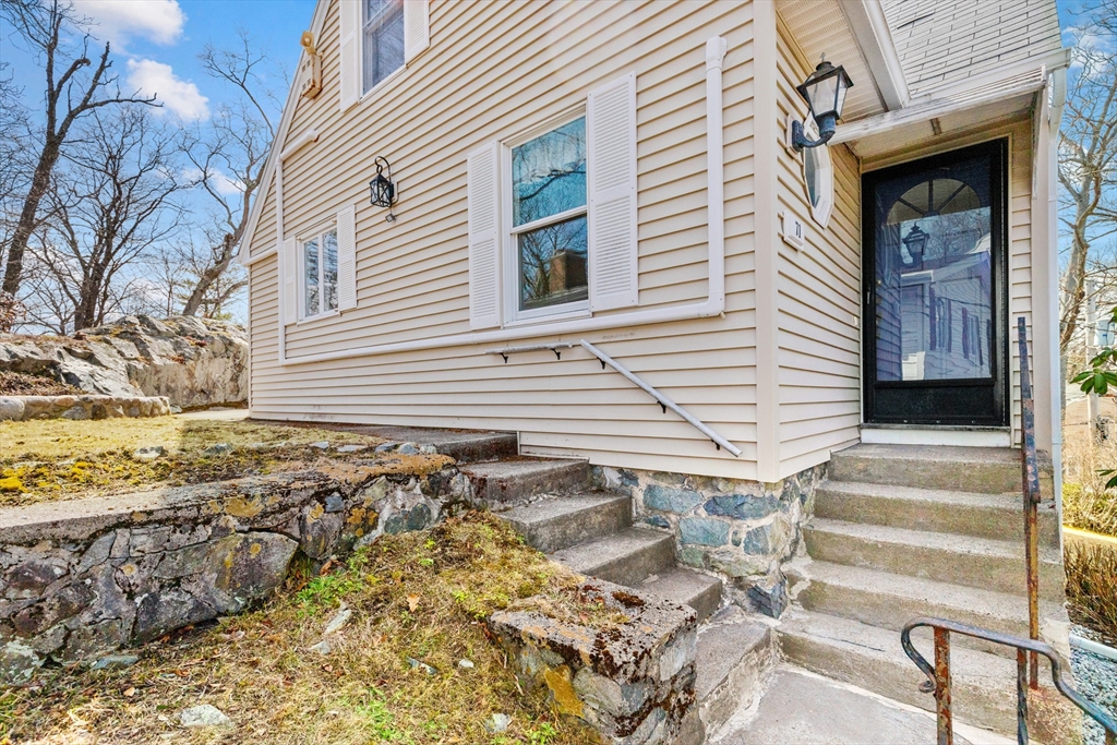 71 Woodland Road Malden, MA 02148 - Photo 4 of 41 a view of a house with a yard