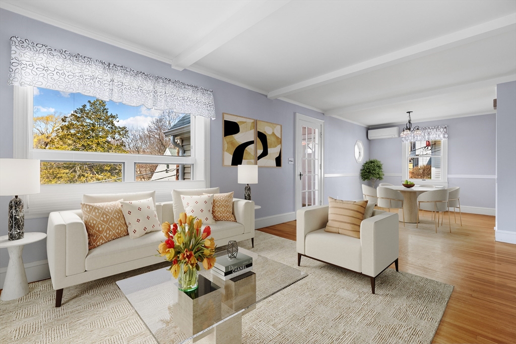 71 Woodland Road Malden, MA 02148 - Photo 5 of 41 a living room with furniture and a painting on the wall