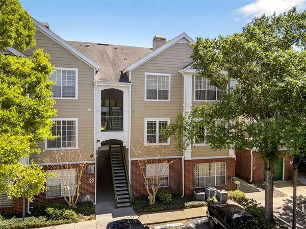 a front view of a house with parking space