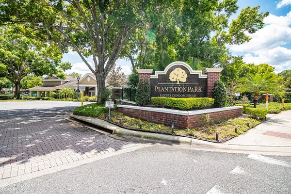 a front view of a house with a yard and outdoor seating
