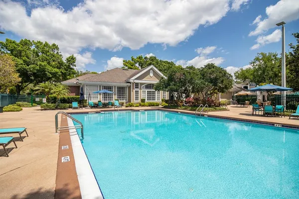 a view of a swimming pool with a patio
