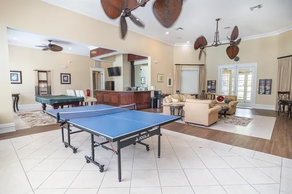 a room with furniture and view of kitchen
