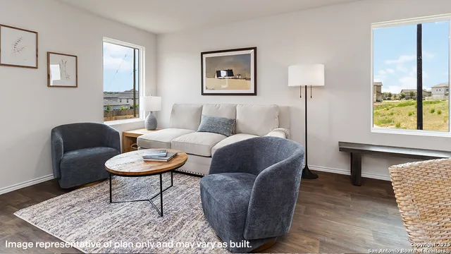 a living room with furniture and a window